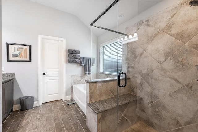 4037 Knightsbridge Ln, Midlothian, TX 76065 - full bathroom with a stall shower, lofted ceiling, a bath, vanity, and wood finished floors