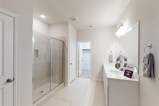 925 Plaza Ln, Argyle, TX 76226 - full bath with double vanity, visible vents, a shower stall, and a spacious closet