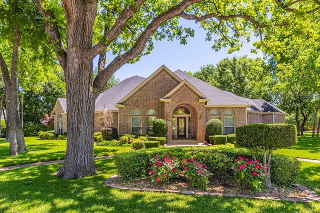 6200 Forest River Dr, Fort Worth, TX 76112 - ranch-style home featuring a front lawn, brick siding, and roof with shingles