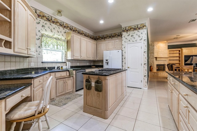 6200 Forest River Dr, Fort Worth, TX 76112 - kitchen featuring dark stone countertops, open shelves, crown molding, a kitchen island, and appliances with stainless steel finishes