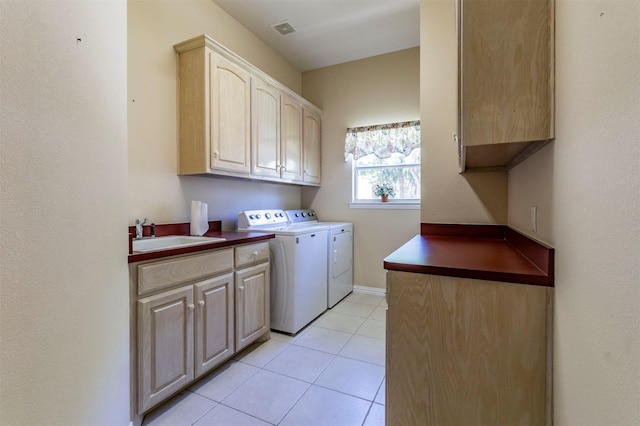 6200 Forest River Dr, Fort Worth, TX 76112 - clothes washing area with washing machine and dryer, light tile patterned floors, a sink, cabinet space, and visible vents
