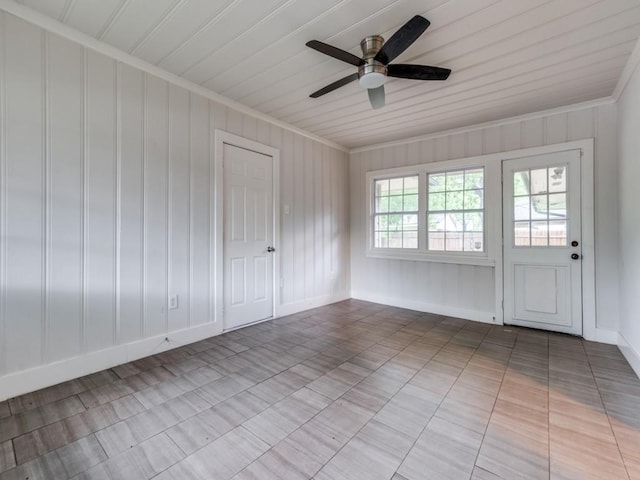 3703 Clover Ln, Dallas, TX 75220 - tiled spare room featuring crown molding, baseboards, and a ceiling fan