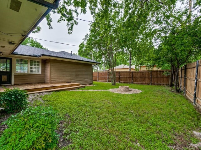 3703 Clover Ln, Dallas, TX 75220 - view of yard with a deck, a fire pit, and a fenced backyard