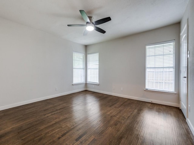 3703 Clover Ln, Dallas, TX 75220 - empty room featuring baseboards, dark wood finished floors, and ceiling fan