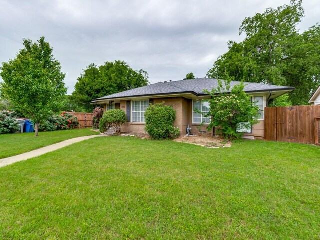 3703 Clover Ln, Dallas, TX 75220 - single story home with roof with shingles, fence, and a front yard