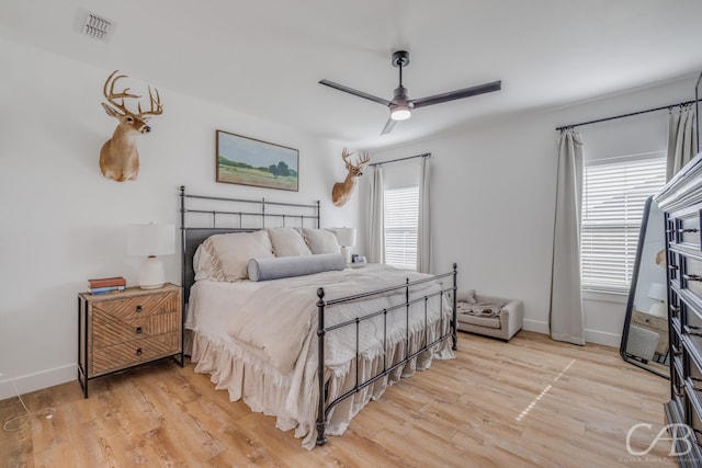7001 Breezeway Dr, Abilene, TX 79606 - bedroom featuring baseboards, light wood-type flooring, visible vents, and a ceiling fan