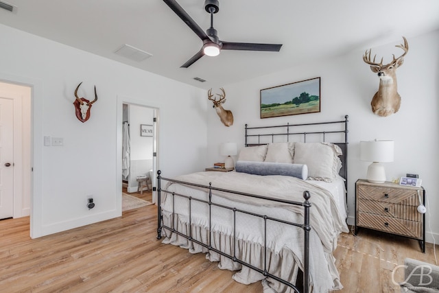 7001 Breezeway Dr, Abilene, TX 79606 - bedroom with connected bathroom, visible vents, light wood-style flooring, and baseboards