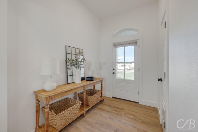 7001 Breezeway Dr, Abilene, TX 79606 - doorway featuring baseboards and light wood-style flooring