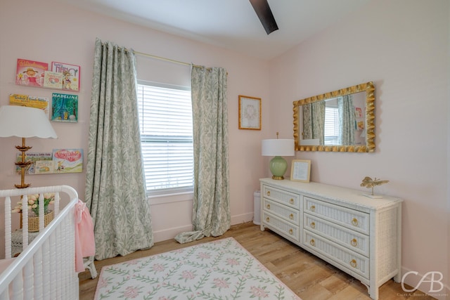 7001 Breezeway Dr, Abilene, TX 79606 - bedroom with multiple windows, light wood-style floors, baseboards, and a ceiling fan
