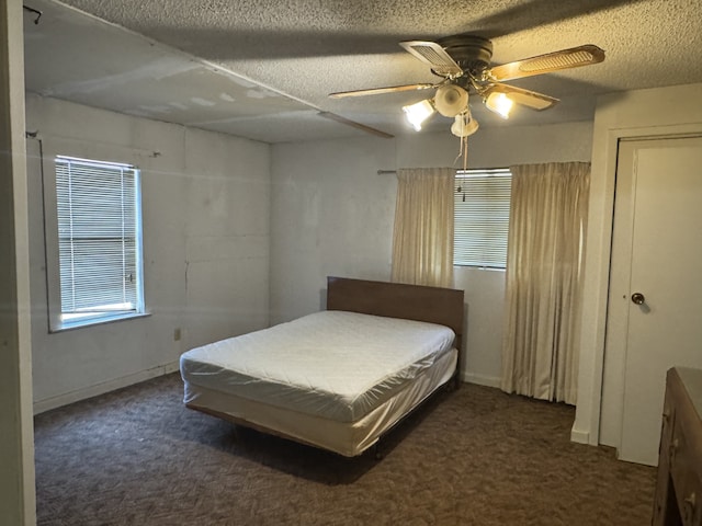 2466 Green St, Abilene, TX 79603 - bedroom featuring carpet, a textured ceiling, and a ceiling fan