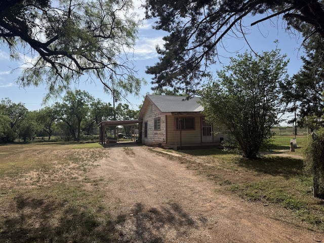 2466 Green St, Abilene, TX 79603 - view of front of home with dirt driveway and a carport