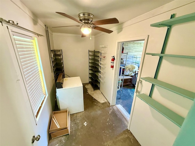 interior space with ceiling fan