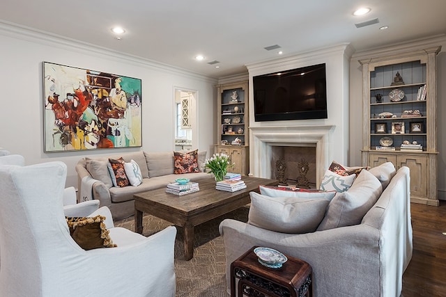 living area with built in features, visible vents, dark wood-style floors, ornamental molding, and recessed lighting