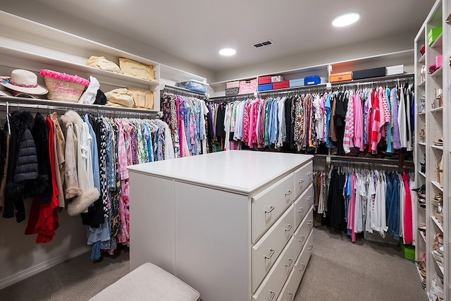 spacious closet featuring carpet flooring and visible vents