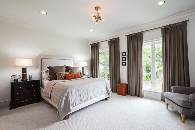 bedroom with light colored carpet, ornamental molding, and recessed lighting