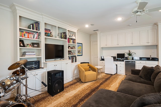 living room with recessed lighting, crown molding, built in desk, and visible vents