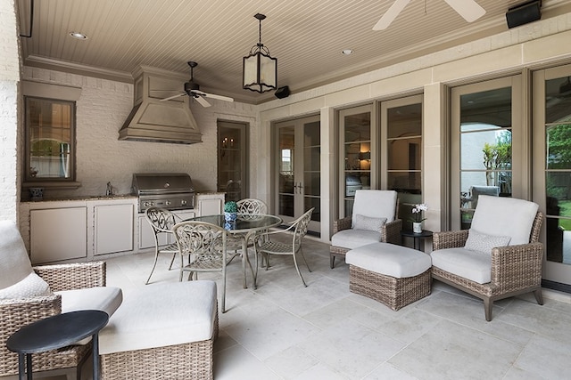 view of patio / terrace featuring french doors, outdoor dining space, area for grilling, and ceiling fan