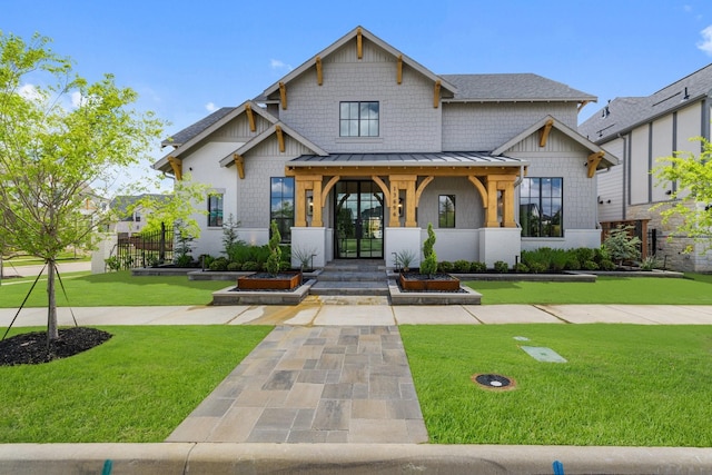 13696 Declan St, Frisco, TX 75033 - view of front of home featuring a standing seam roof, a front lawn, metal roof, and french doors