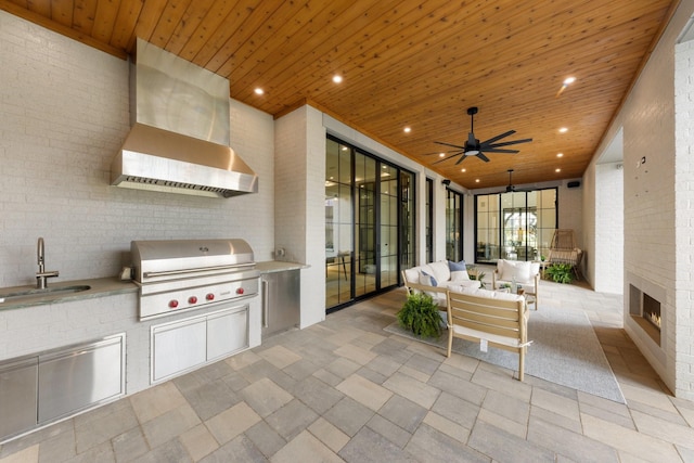 13696 Declan St, Frisco, TX 75033 - view of patio with grilling area, a sink, area for grilling, ceiling fan, and an outdoor living space with a fireplace