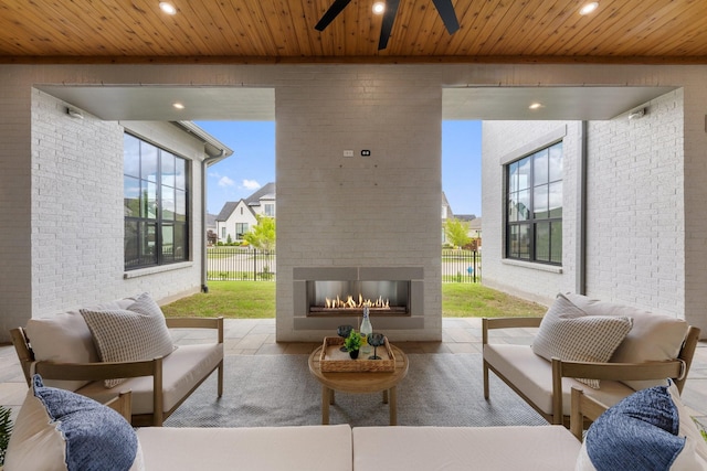 13696 Declan St, Frisco, TX 75033 - view of patio featuring fence, ceiling fan, an outdoor living space with a fireplace, and a residential view