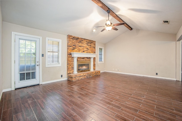 122 Big Bend Blvd, Waxahachie, TX 75165 - unfurnished living room with a ceiling fan, dark wood-style flooring, baseboards, and a brick fireplace