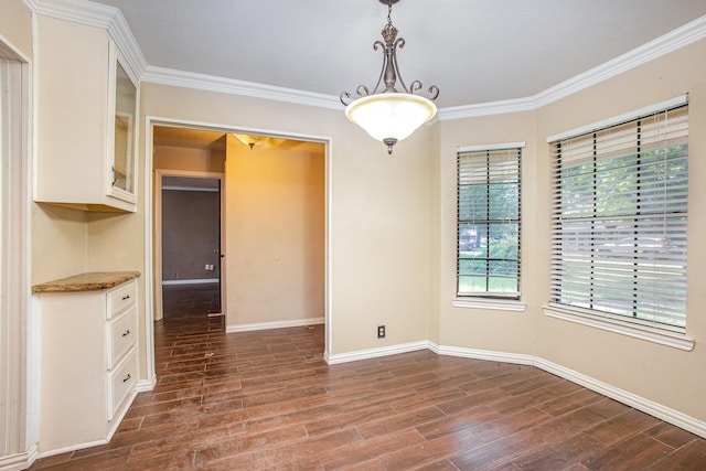 122 Big Bend Blvd, Waxahachie, TX 75165 - unfurnished dining area with dark wood-style floors, baseboards, and crown molding
