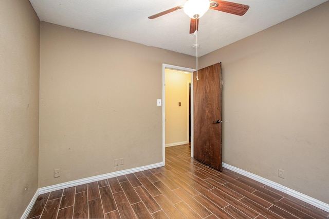 122 Big Bend Blvd, Waxahachie, TX 75165 - empty room with a ceiling fan, dark wood-type flooring, and baseboards