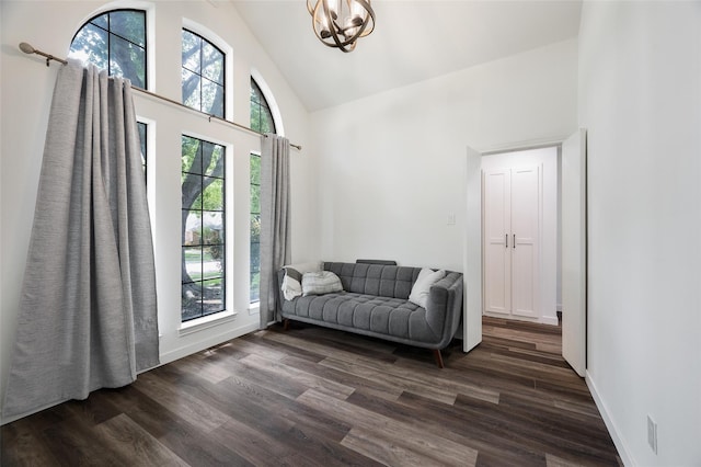 1413 Pecan Creek Dr, Garland, TX 75044 - sitting room with baseboards, a chandelier, high vaulted ceiling, and dark wood-style floors
