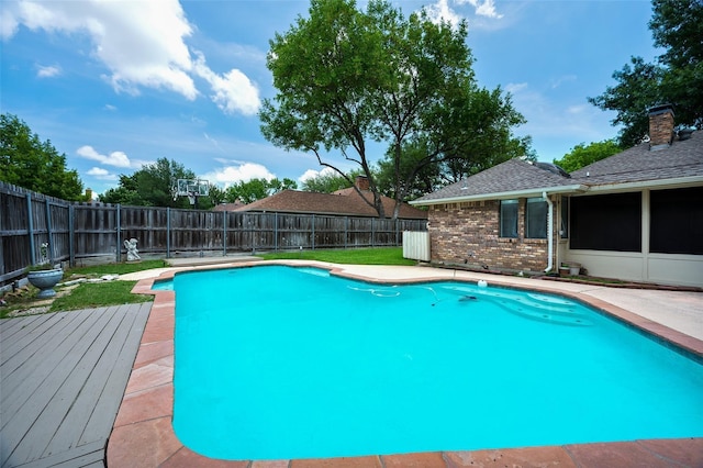 1413 Pecan Creek Dr, Garland, TX 75044 - view of pool featuring a fenced backyard, a wooden deck, and a fenced in pool