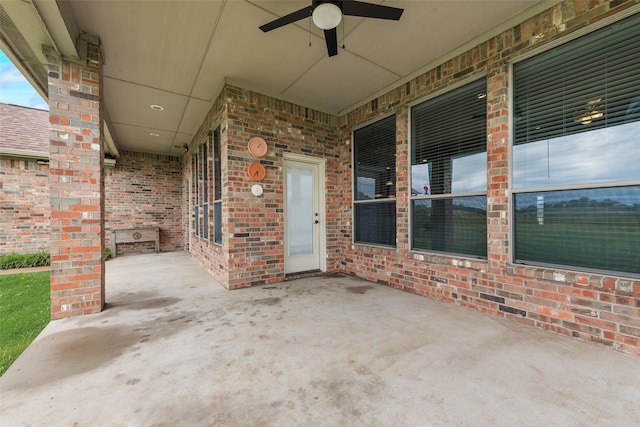 view of patio featuring ceiling fan