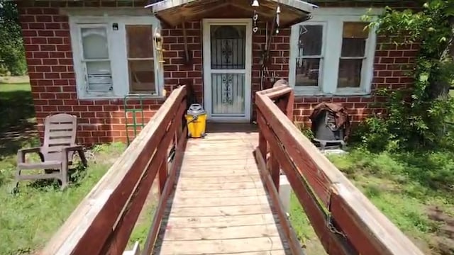 exterior space featuring brick siding