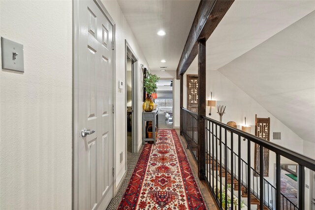 3517 Woods Blvd, Tyler, TX 75707 - hall featuring recessed lighting, an upstairs landing, visible vents, and vaulted ceiling