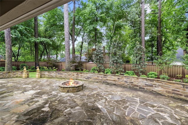 3517 Woods Blvd, Tyler, TX 75707 - view of patio / terrace with a fire pit and a fenced backyard