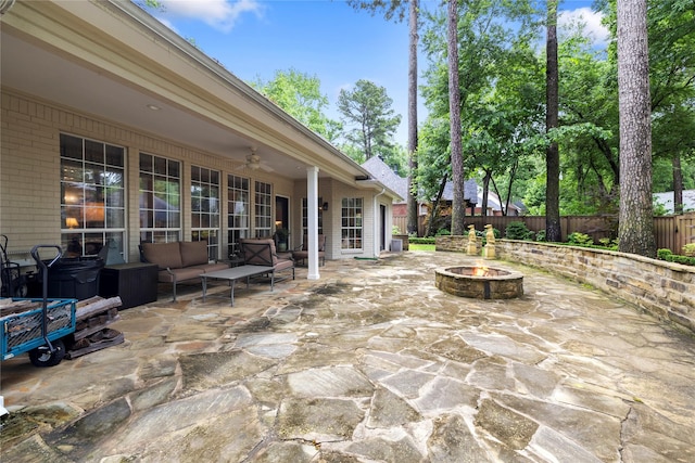 3517 Woods Blvd, Tyler, TX 75707 - view of patio / terrace with a fenced backyard, ceiling fan, and an outdoor living space with a fire pit