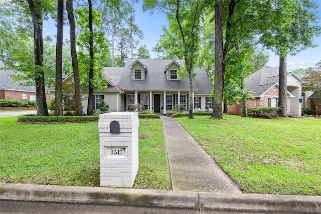 3517 Woods Blvd, Tyler, TX 75707 - cape cod home featuring a front lawn