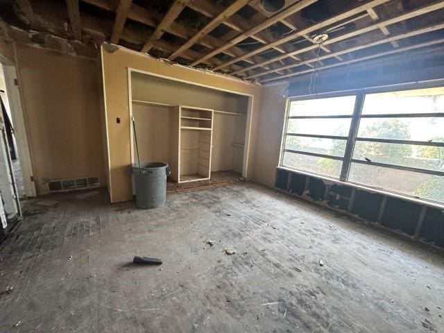 unfurnished bedroom featuring a closet and visible vents