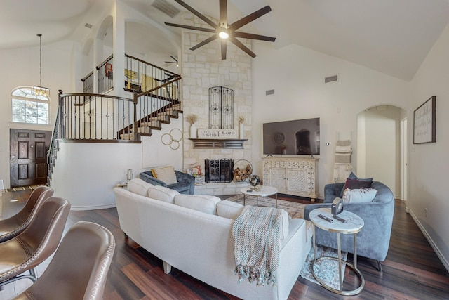 1433 Ocotillo Ln, Fort Worth, TX 76177 - living area featuring high vaulted ceiling, arched walkways, ceiling fan, stairs, and wood finished floors