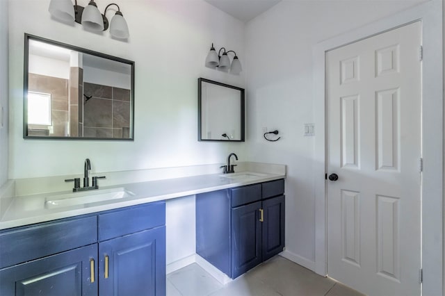 1014 Trinity St, Cleburne, TX 76031 - bathroom featuring double vanity, tile patterned floors, and baseboards