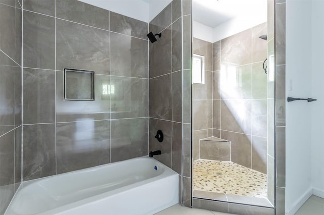 1014 Trinity St, Cleburne, TX 76031 - bathroom featuring tiled shower and a tub