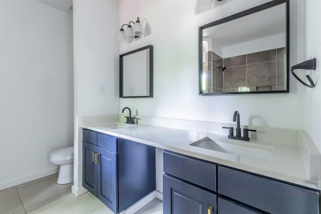 1014 Trinity St, Cleburne, TX 76031 - full bath featuring toilet, tile patterned floors, double vanity, a shower, and baseboards