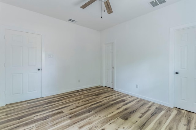 1014 Trinity St, Cleburne, TX 76031 - spare room featuring a ceiling fan, light wood-type flooring, and baseboards