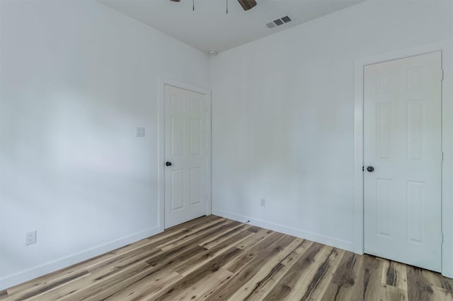 1014 Trinity St, Cleburne, TX 76031 - unfurnished room featuring light wood-style floors, baseboards, and a ceiling fan