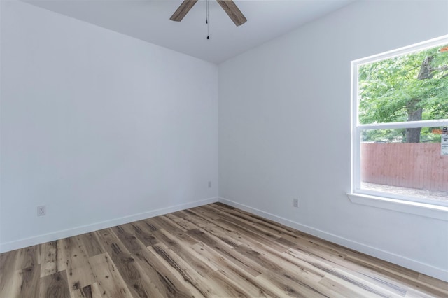 1014 Trinity St, Cleburne, TX 76031 - unfurnished room with ceiling fan, wood finished floors, and baseboards