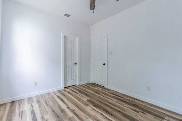 1014 Trinity St, Cleburne, TX 76031 - empty room with light wood-style flooring, ceiling fan, and baseboards