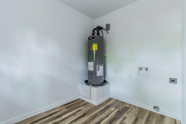 1014 Trinity St, Cleburne, TX 76031 - utility room featuring electric water heater