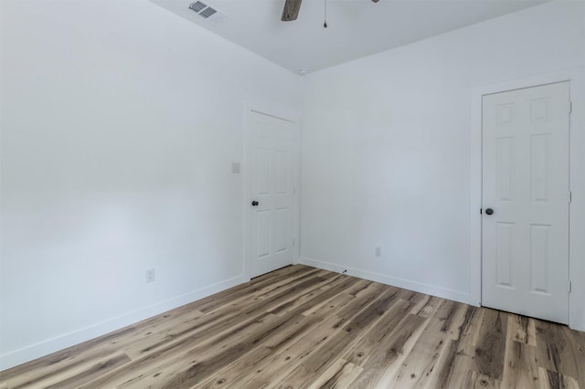 1014 Trinity St, Cleburne, TX 76031 - spare room with light wood-style flooring, baseboards, and ceiling fan