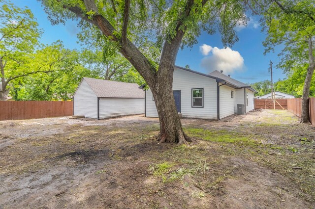 1014 Trinity St, Cleburne, TX 76031 - view of side of property with a fenced backyard and central AC unit