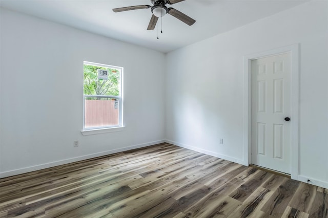 1014 Trinity St, Cleburne, TX 76031 - unfurnished room with wood finished floors, ceiling fan, and baseboards