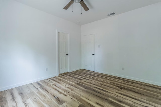 1014 Trinity St, Cleburne, TX 76031 - spare room with wood finished floors, ceiling fan, and baseboards