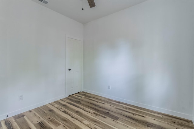 1014 Trinity St, Cleburne, TX 76031 - empty room featuring light wood-style flooring, baseboards, and a ceiling fan